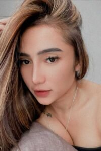 Portrait of a young woman with long brown hair.